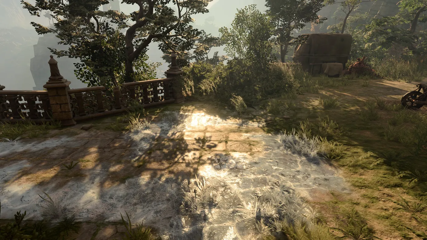 An Ice surface spreading across sunlit paving stones and grass in Baldur's Gate 3, the difficult terrain that forces a Dexterity save to avoid falling Prone.