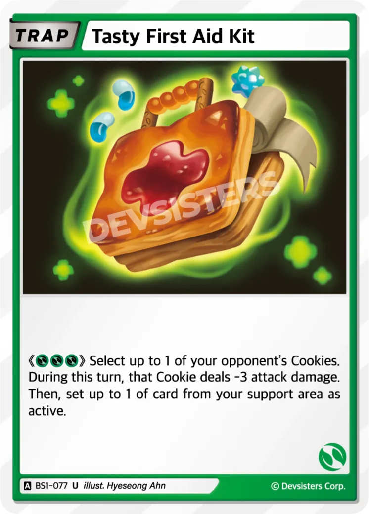 Official Tasty First Aid Kit card (BS1-077), a Green Uncommon Trap showing a glowing cookie-crust first-aid case with a cross-shaped jam splotch on its lid; for three Green it gives an opposing Cookie -3 attack damage this turn, then sets up to one of your support cards active.