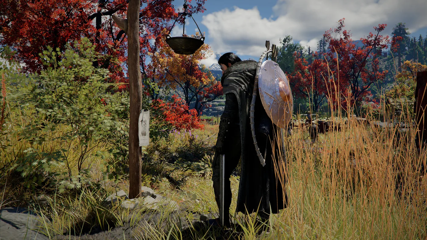 Seen from behind, a dark-haired man in a long black fur-collared coat, with a round steel shield and a bow strapped across his back and a sword in his hand, studies a wanted poster nailed to a wooden post among red and orange autumn trees in Crimson Desert