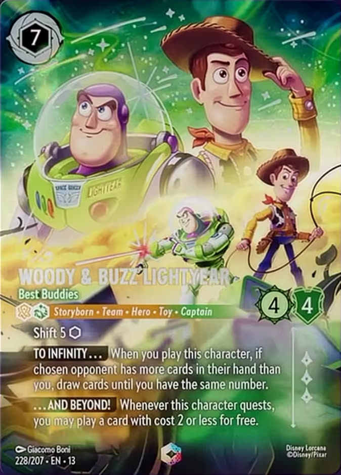 The Enchanted printing of Disney Lorcana card Woody & Buzz Lightyear - Best Buddies, numbered 228/207, showing Woody tipping his hat beside Buzz Lightyear against a green cosmic background, with borderless art and the card text overlaid directly on the illustration.