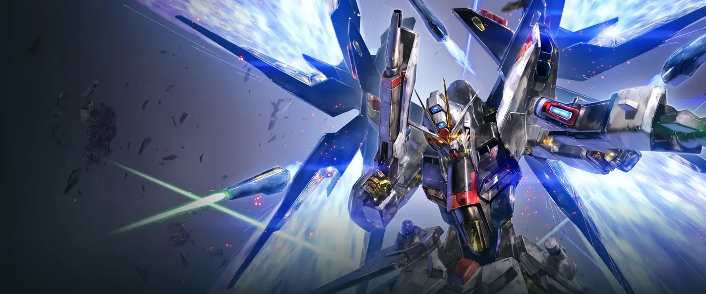 Official Bandai key visual for the GUNDAM CARD GAME booster set Freedom Ascension: a silver, blue and gold Strike Freedom Gundam bursting toward the viewer from a white energy flare, its winged binders fanned out around it, red particle sparks and shattered debris drifting across a dark grey background, with a green beam cutting in from the left.