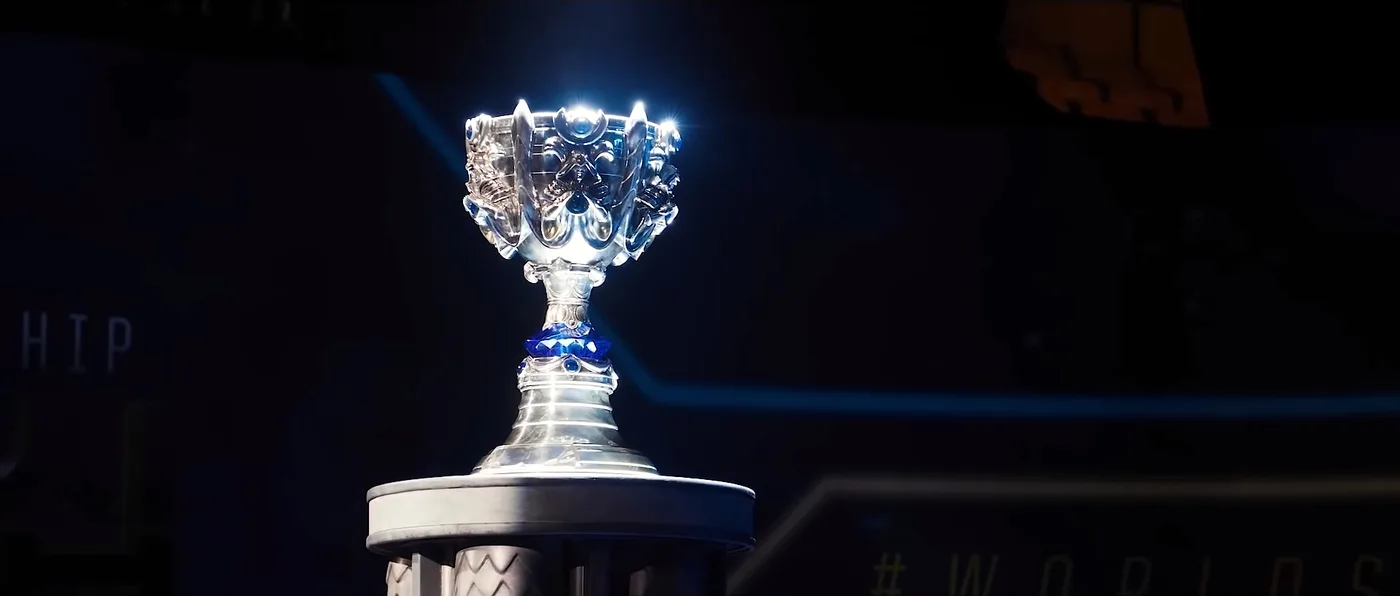 The Summoner's Cup, League of Legends' championship trophy, displayed on a lit stand.