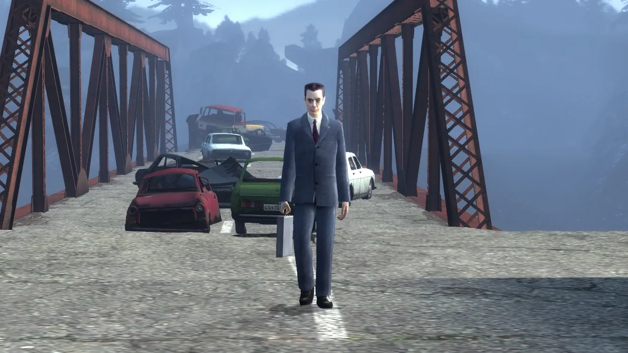 The G-Man walking toward the camera across a steel truss bridge piled with abandoned cars, a misty forested valley behind him, in Half-Life 2: Episode Two's Freeman Pontifex chapter.