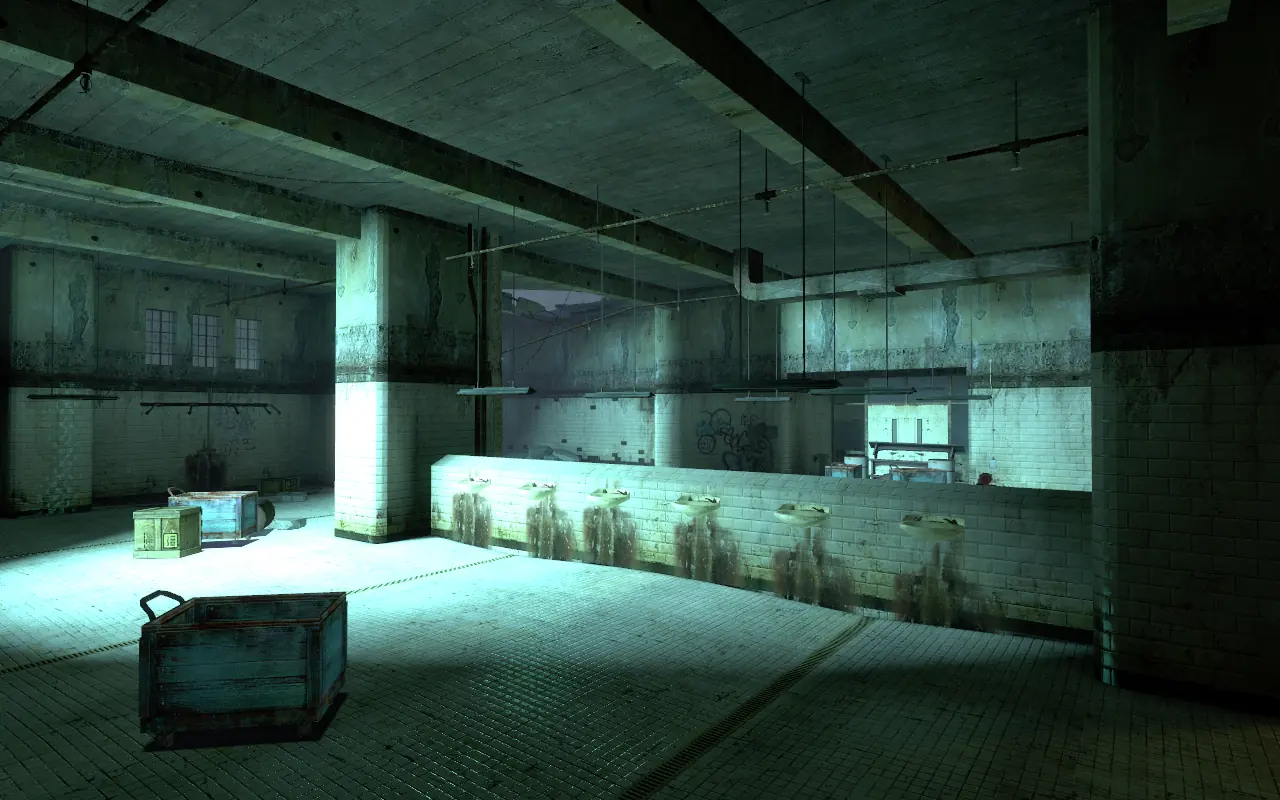 The Nova Prospekt washroom: a long tiled hall with a row of sinks along a low brick wall, blue laundry carts and a supply crate on the tiled floor, lit by cold light from high windows.