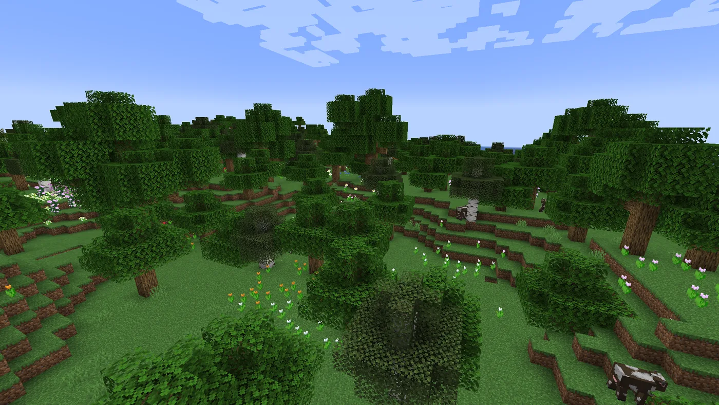 A Minecraft flower forest seen from a hillside: rolling oak and birch woodland over grass, with scattered patches of orange, white and pink tulips and other small flowers between the trees.