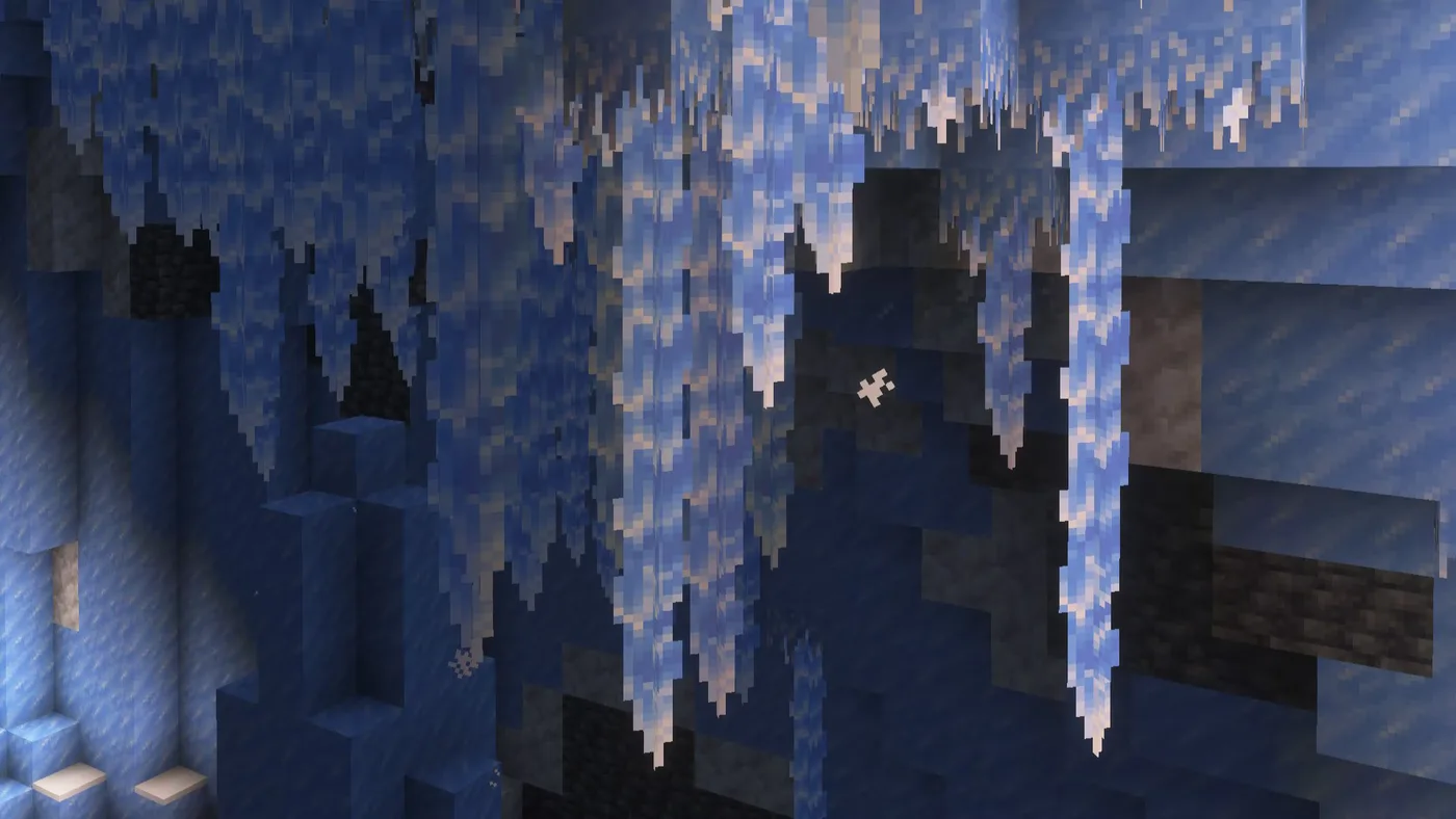 Long blue-and-white icicles hanging in dense rows from the ceiling of a Minecraft ice cave, with dark stone and deepslate showing in the wall between them.