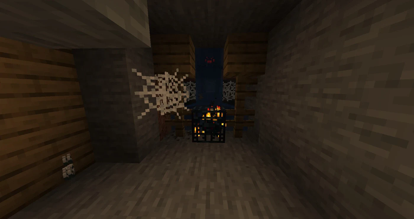 A Minecraft cave spider spawner in an abandoned mineshaft surrounded by cobwebs