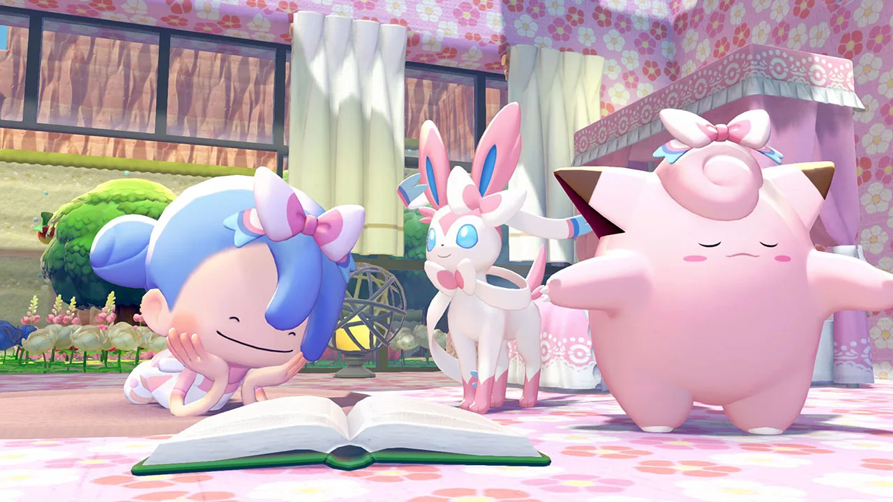 A blue-haired human-form Ditto wearing a pastel ribbon bow sits on the floor reading a book next to Sylveon, which wears a matching ribbon, and Clefable, which wears a pink bow, in a flower-patterned Pokopia room.