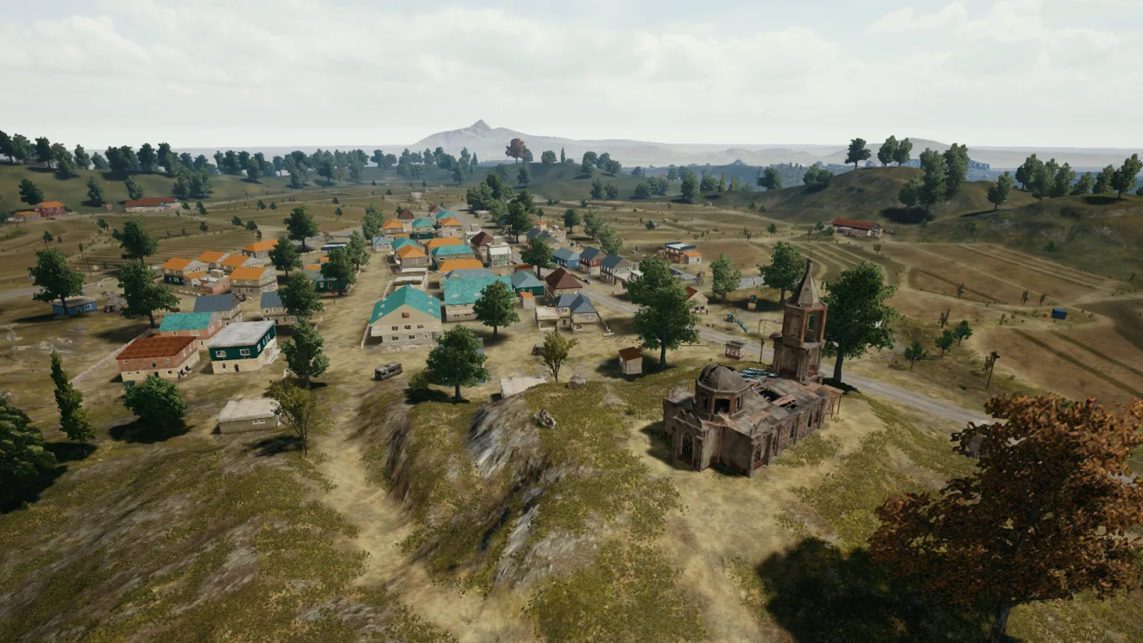 Pochinki on Erangel — the kind of named town squads use as a shared landmark in callouts so everyone knows where 'the church' or 'north side' means.