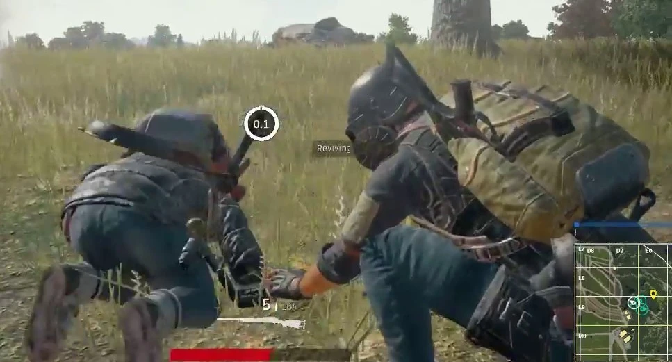 A knocked (DBNO) PUBG player crawling on the ground — down but not out, with a shrinking bleed-out timer ticking until a teammate revives them.