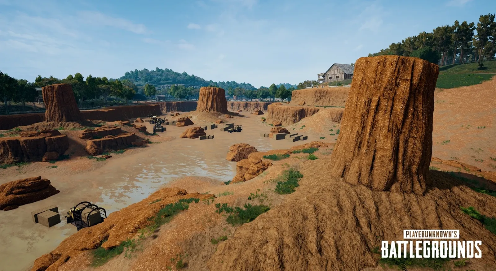 The Quarry on Sanhok — vehicles parked among rock pillars and open crates of supplies, the kind of environmental evidence that tells you who has been here and how recently.