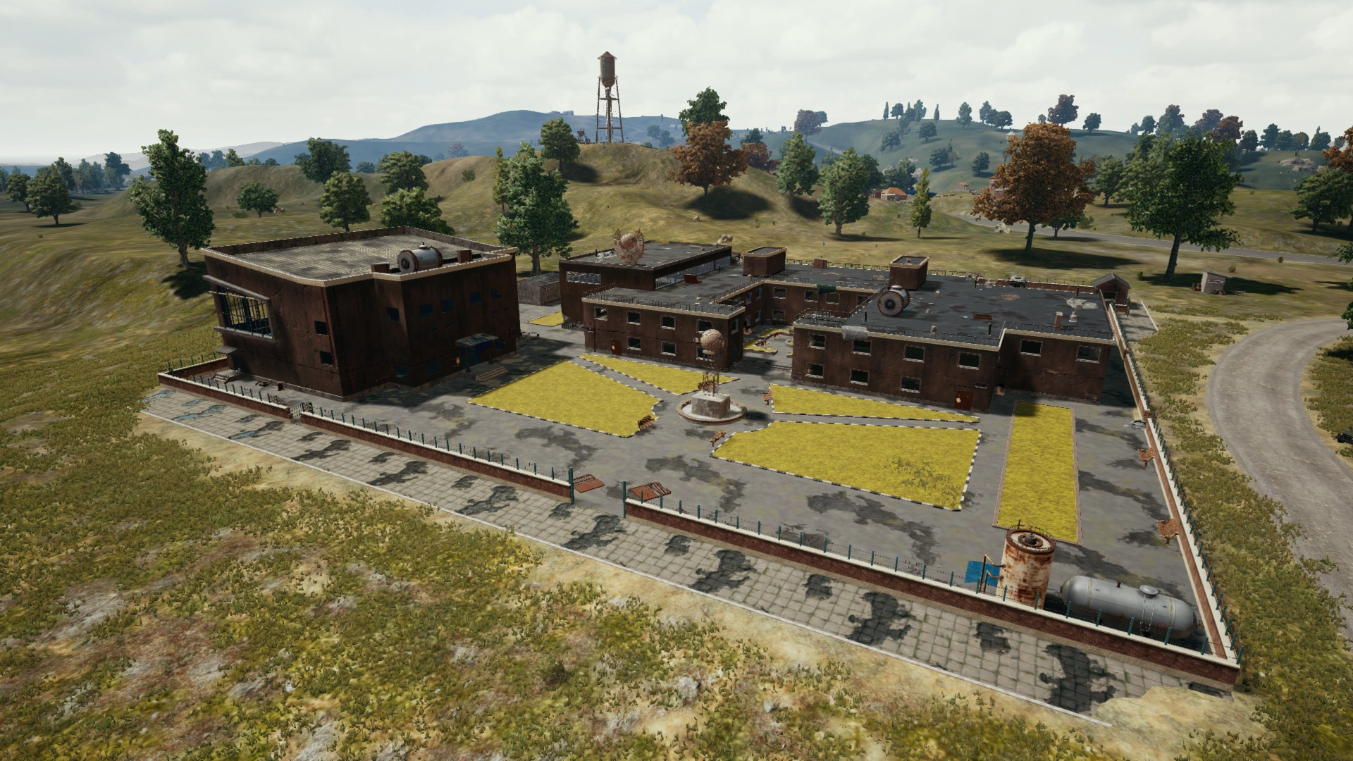 PUBG's School on Erangel โ a classic close-quarters squad arena where holding two angles in a crossfire beats stacking on one wall.
