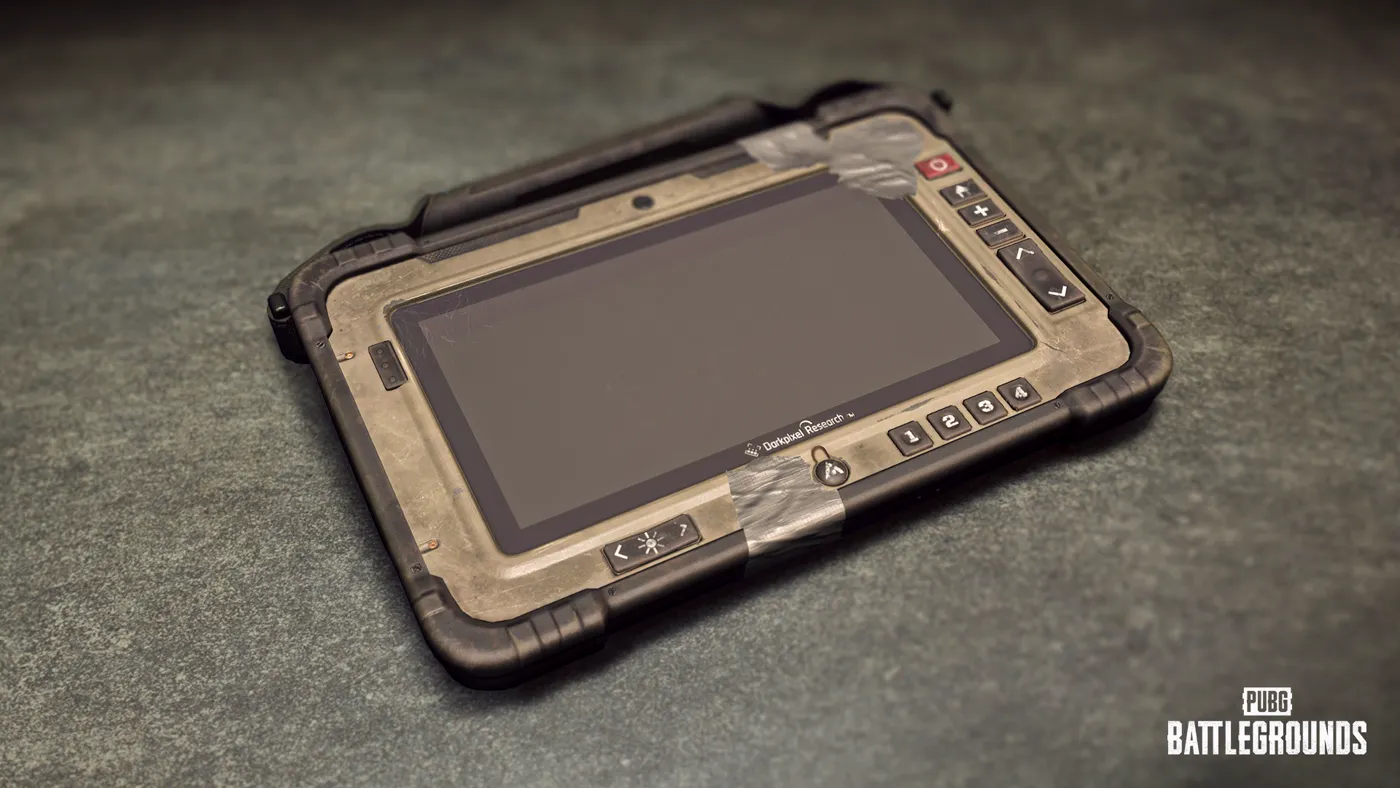 The Blue Chip Detector tablet from PUBG — a rugged handheld device with a taped-up screen, lying on concrete.