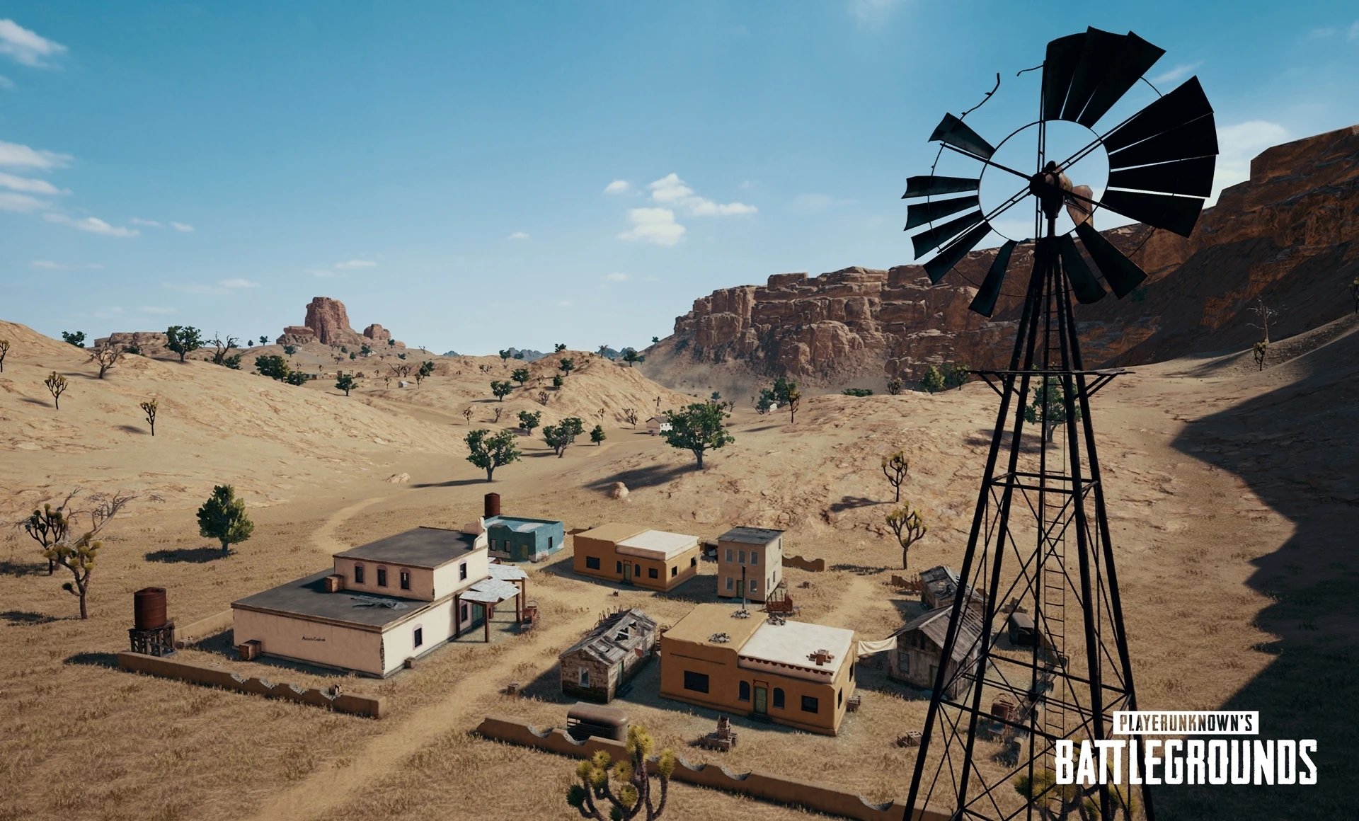 Open Miramar terrain with long sightlines and sparse cover — the kind of ground where third-person's over-cover camera and first-person's honest sightlines play completely differently.
