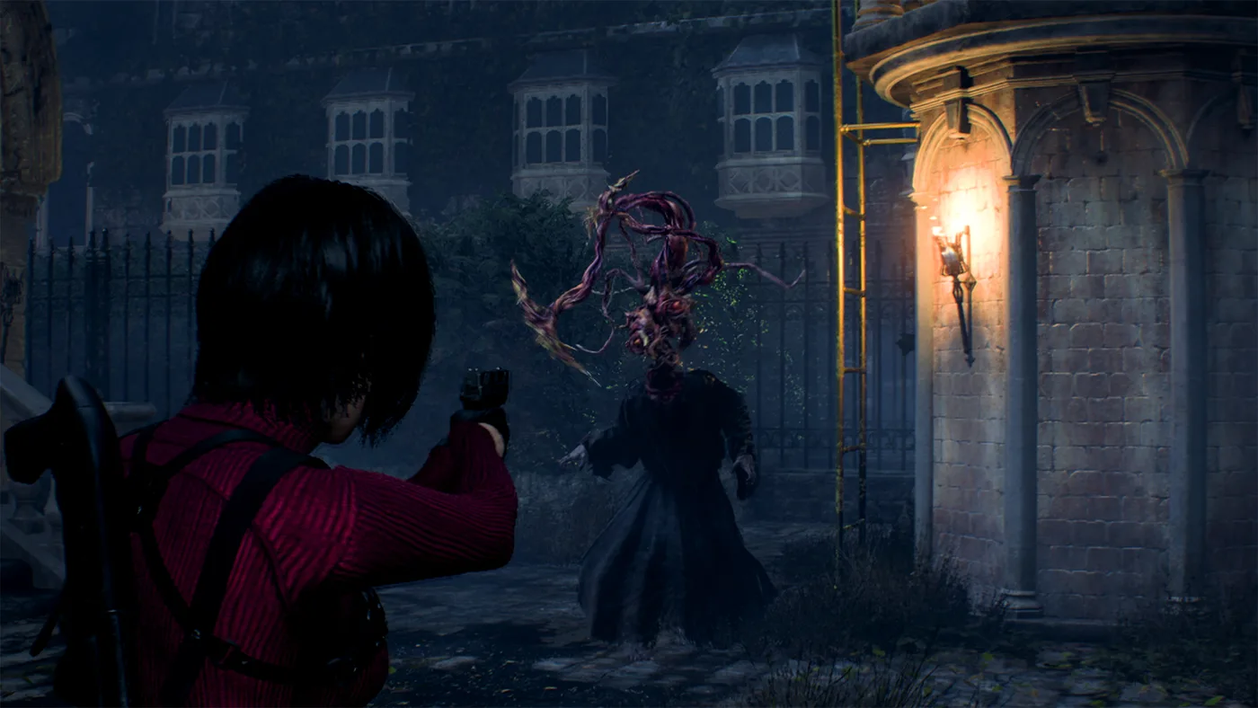 Ada Wong in her red sweater, a weapon slung across her back, aiming a handgun at a robed cultist whose head has burst open into writhing Plaga tentacles, in front of an iron fence and a lamp-lit stone tower at night, in a Resident Evil 4 Gold Edition screenshot from Nintendo's Switch 2 store listing.