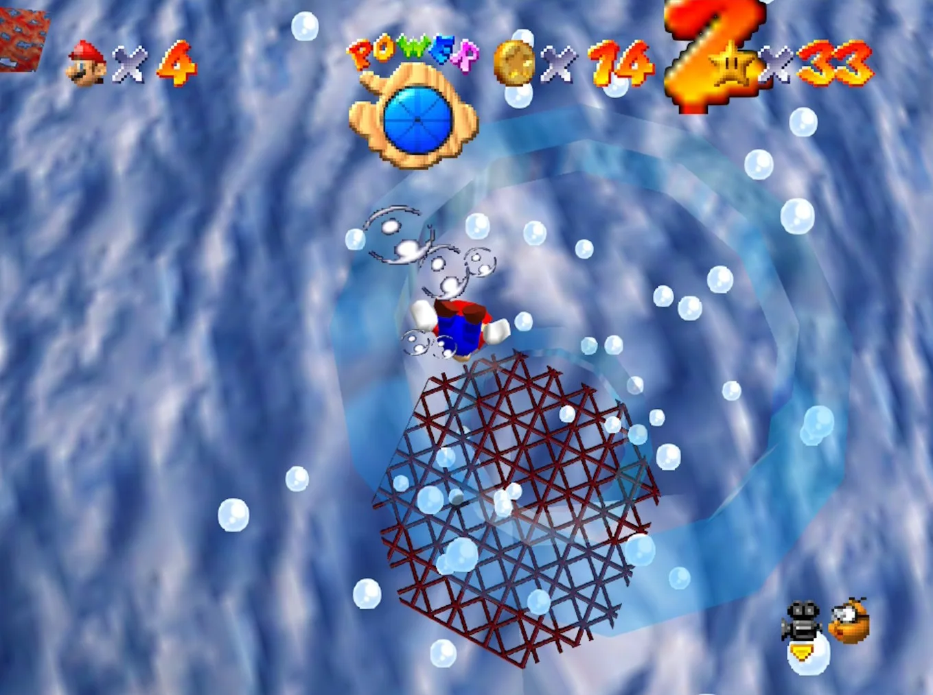 Mario swimming underwater in Dire, Dire Docks in Super Mario 64, approaching a bubble ring rising from the steel grate on the floor of the second area.
