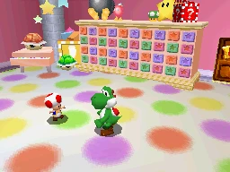 Yoshi standing beside a Toad in the Rec Room of Super Mario 64 DS, on a polka-dot floor in front of a long cabinet of coloured drawers marked with stars, with a Bob-omb, a 1-Up Mushroom, a Power Star and red blocks on top of the cabinet, and a red Koopa shell on a toy piano and a green shell to the left.