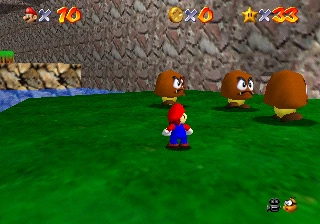Mario dwarfed by three Grand Goombas beside the water on the huge version of Tiny-Huge Island.