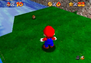 Mario towering over a Micro-Goomba on the grassy field of the tiny version of Tiny-Huge Island.
