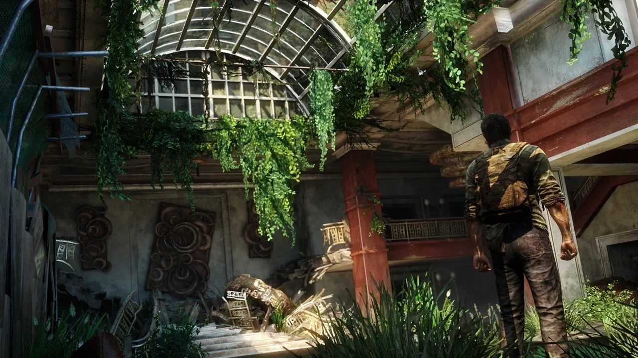 A derelict lobby crowded with infected in The Last of Us — the kind of room Grounded mode forces you to read without Listen Mode or a HUD.