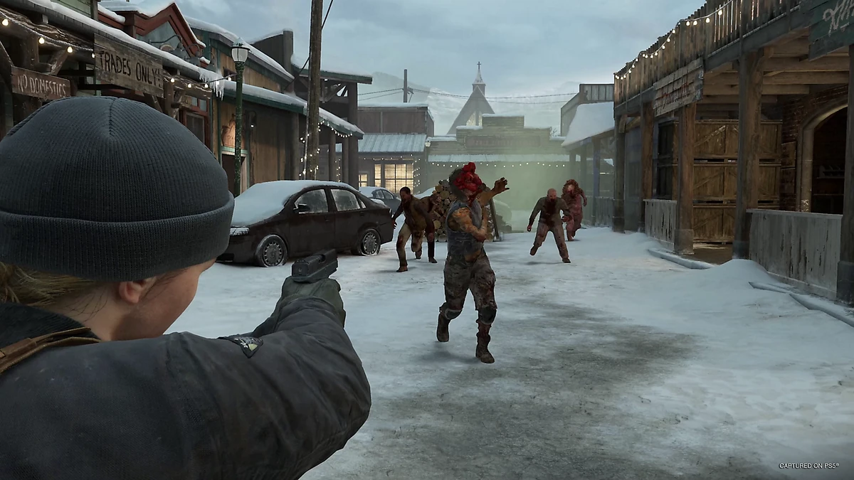 Abby aiming a pistol at runners charging down a snow-covered street in Jackson during a No Return encounter.