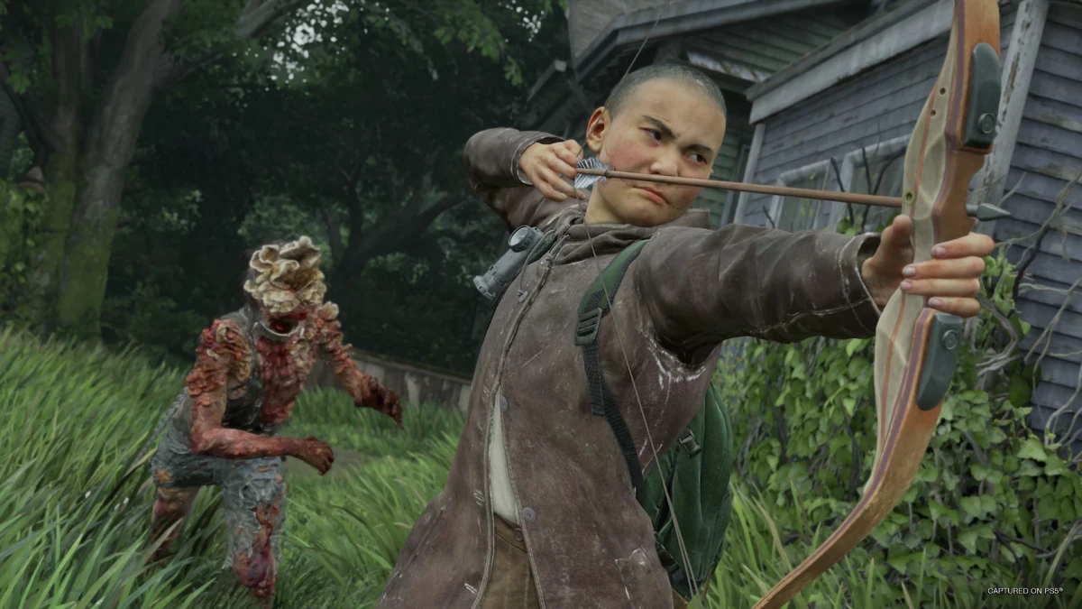 Lev drawing a bow with an arrow nocked while a clicker approaches through tall grass in No Return.