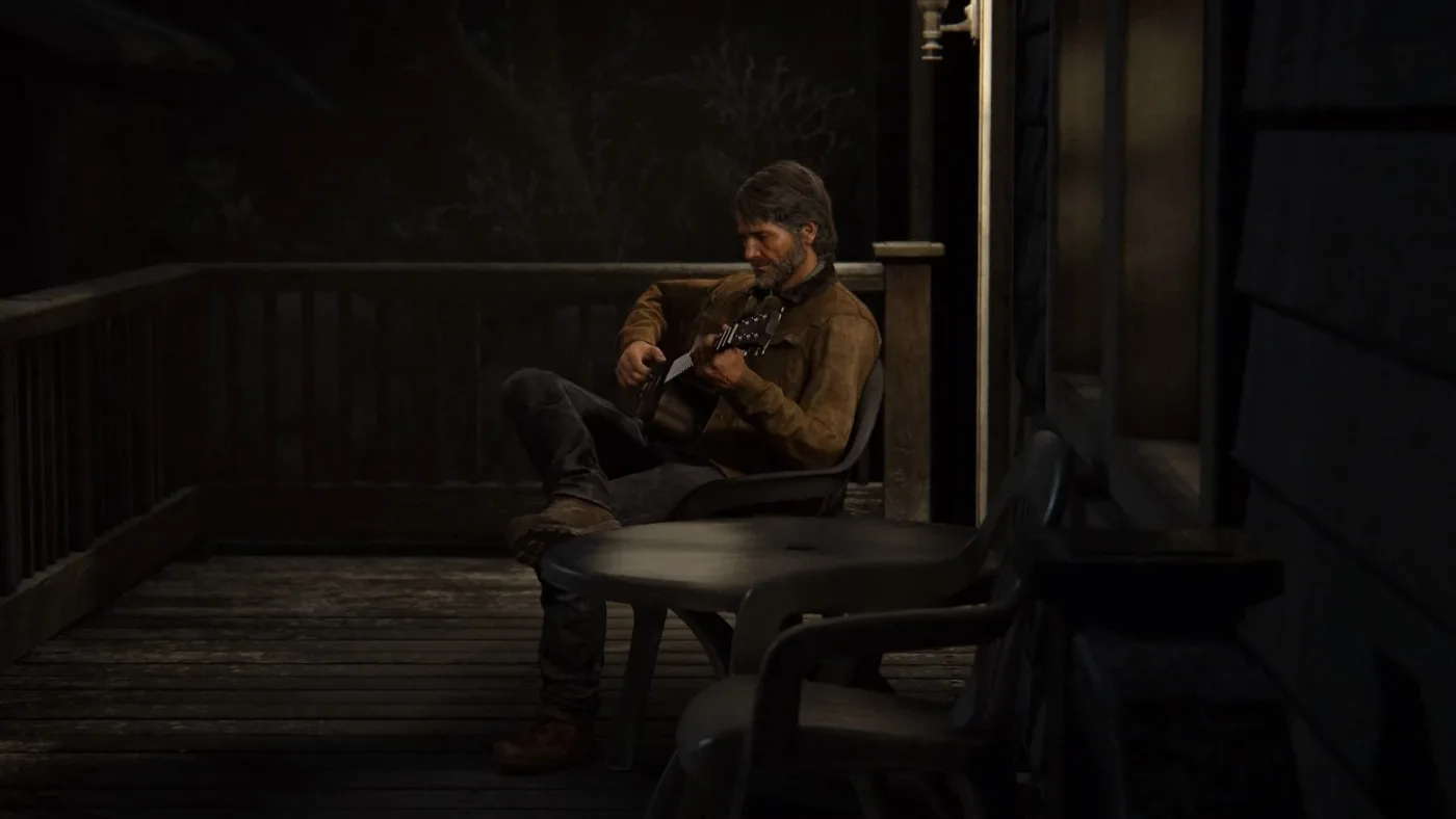 Joel playing guitar on a porch in Jackson, Wyoming, the scene that establishes the instrument Ellie later learns in The Last of Us Part II.
