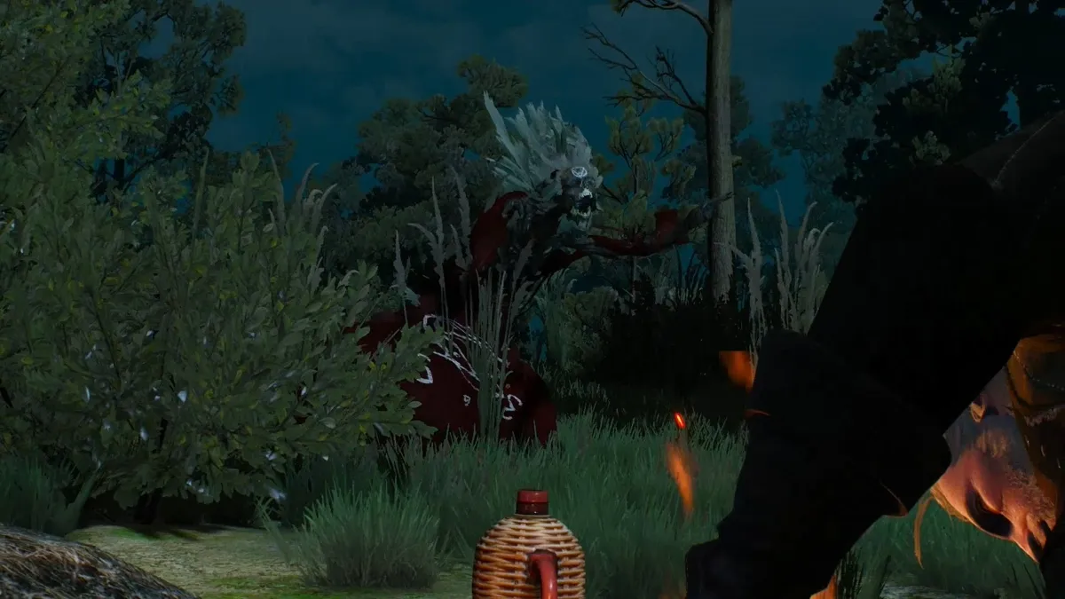 The nightwraith Jenny o' the Woods appearing at night near the field campfire in The Witcher 3.