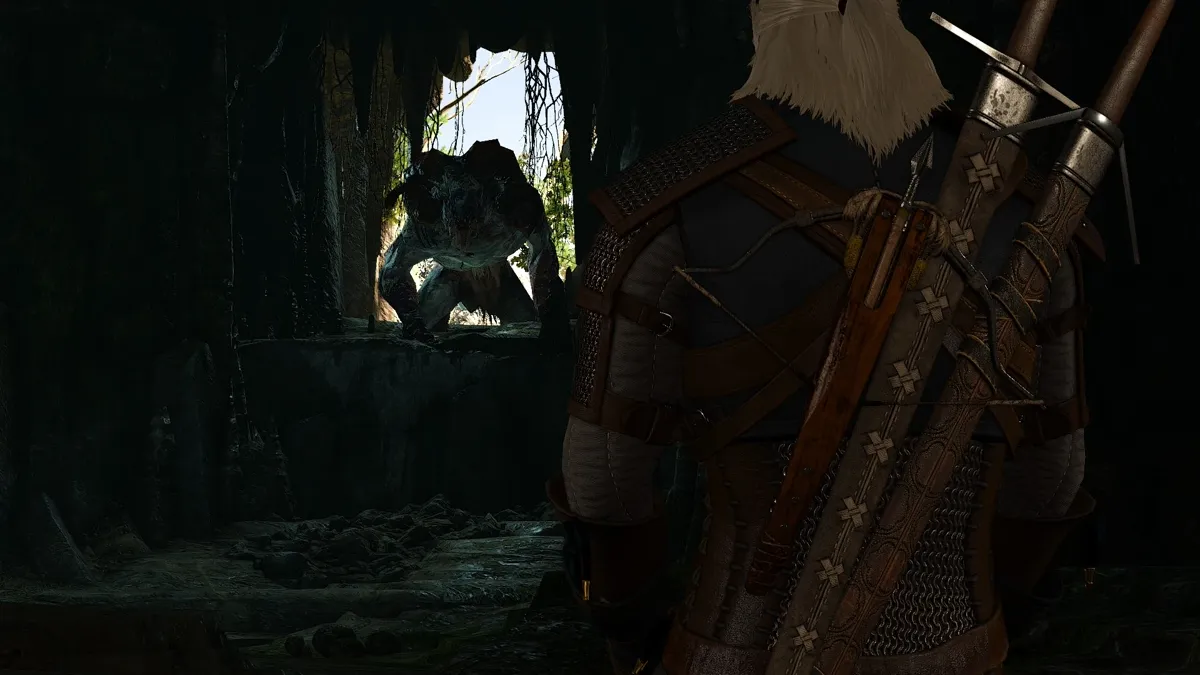 Geralt facing the Howler, the chort from Contract: Mysterious Tracks, at the mouth of its cave lair.