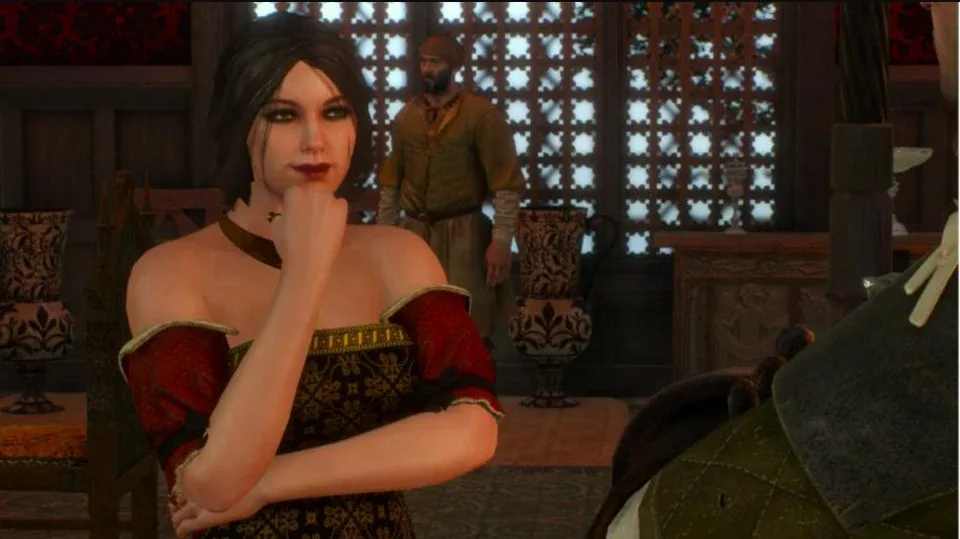 Sasha in a red and gold gown sitting across the gwent table from Geralt at the Passiflora, hand at her chin, considering her move.