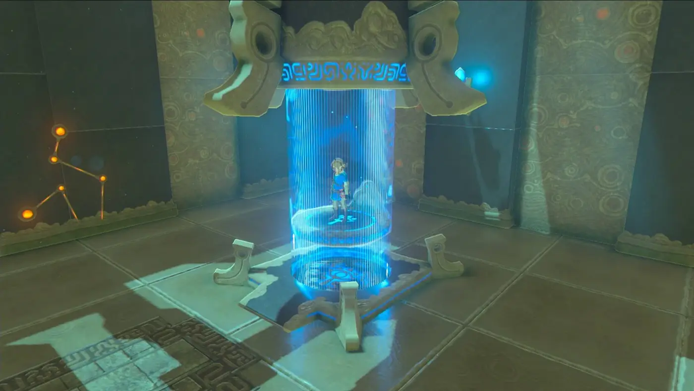 The entrance to an ancient shrine, glowing orange until Link presses the Sheikah Slate to the terminal.