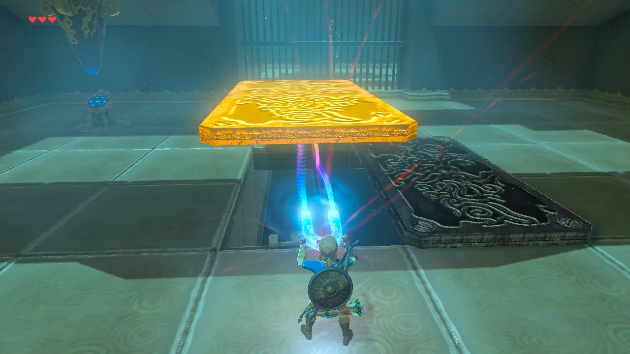 Link using Magnesis inside a Breath of the Wild shrine, a blue and pink magnetic beam lifting a glowing yellow metal floor slab and uncovering the pit beneath it.