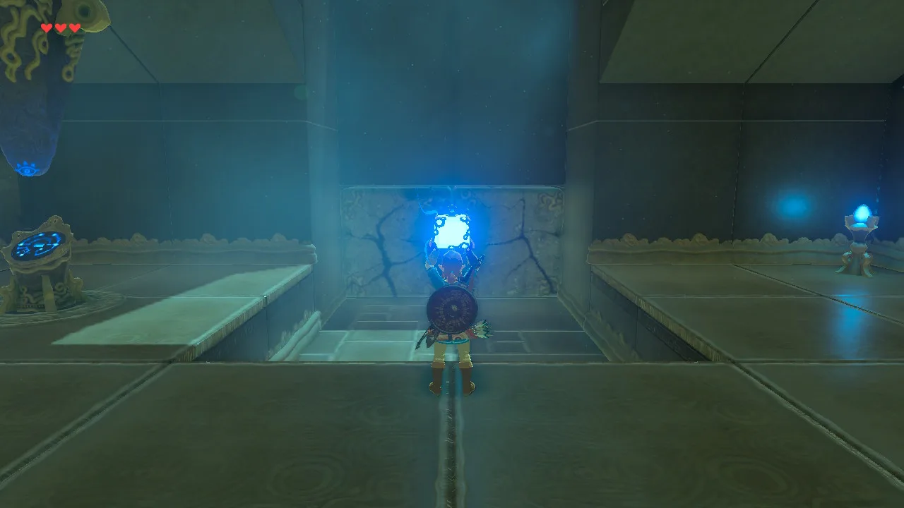 Link holding a glowing blue cube-shaped Remote Bomb above his head in front of a cracked stone wall inside a Breath of the Wild shrine.