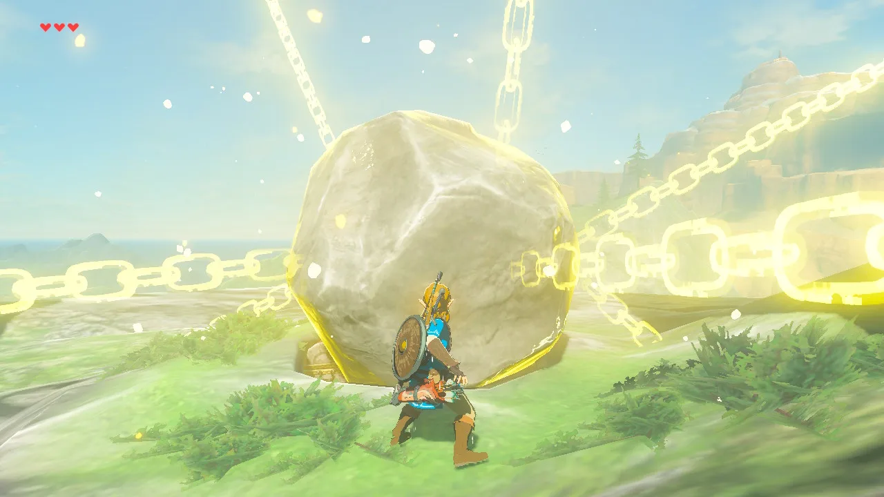 Link standing in front of a large boulder frozen by Stasis in Breath of the Wild, the rock outlined in yellow light with glowing golden chains wrapped around it, on a grassy cliff top under a blue sky.