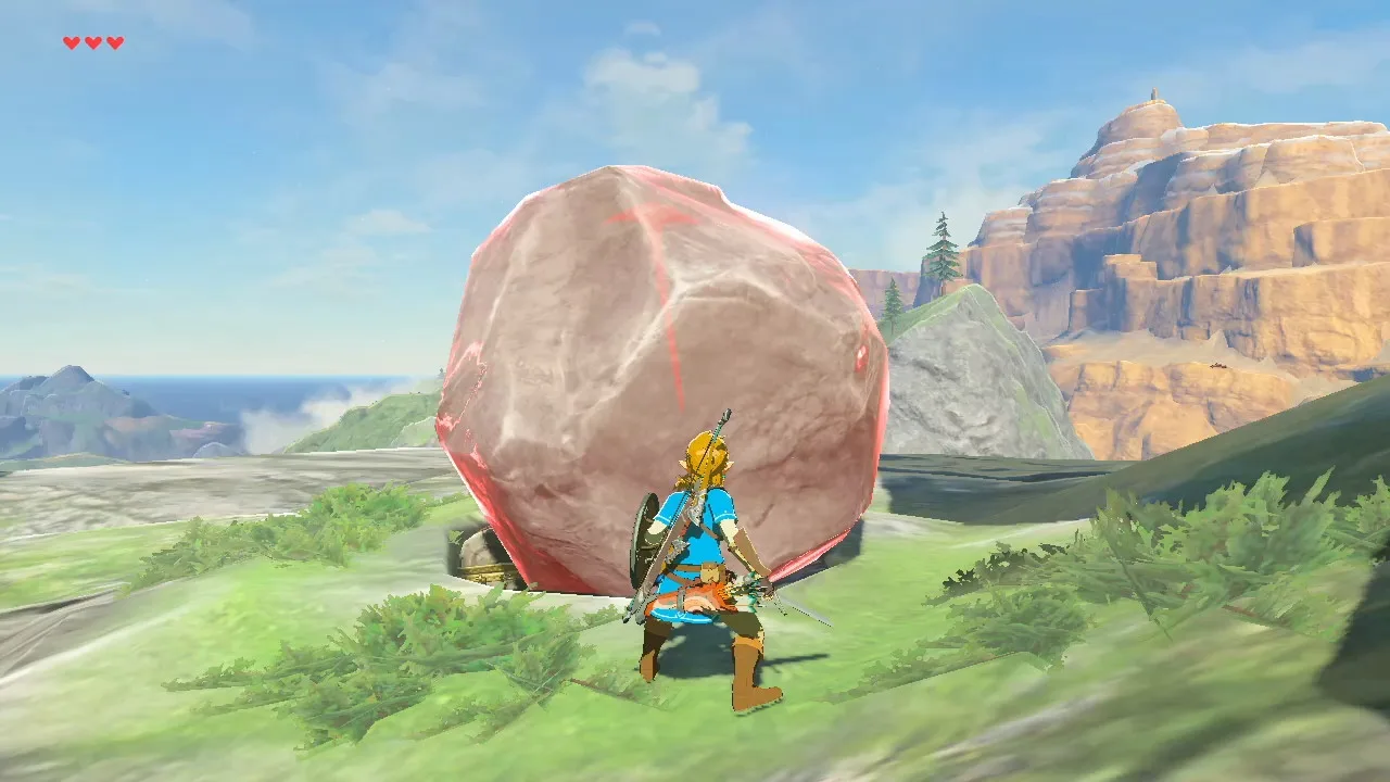 A boulder under Stasis glowing red-pink in Breath of the Wild, the image Zelda Wiki uses to show the force stored by striking a frozen object, with Link standing beside it on a grassy hilltop.