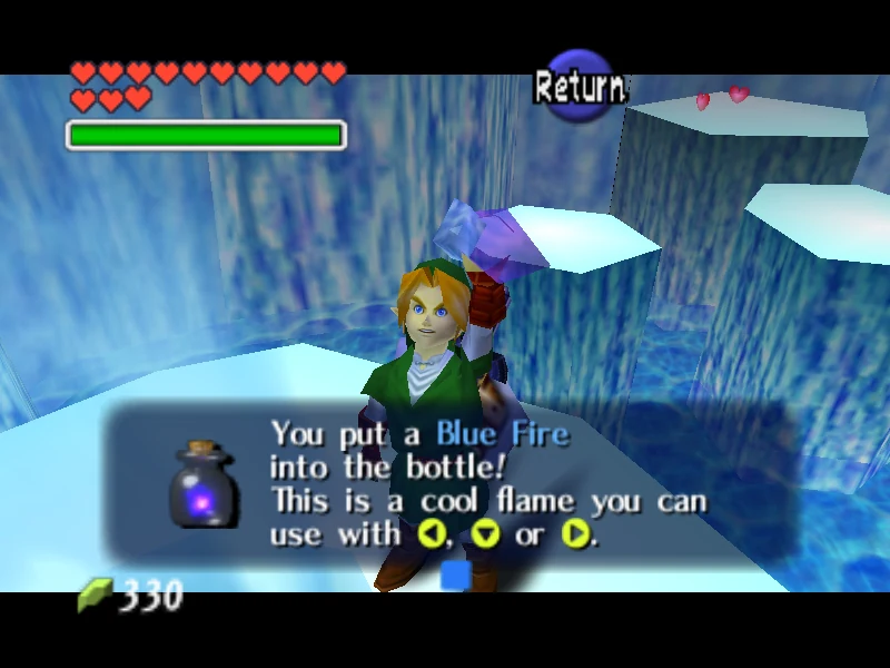Adult Link inside the Ice Cavern in Ocarina of Time holding up a bottle of Blue Fire, with the message "You put a Blue Fire into the bottle! This is a cool flame you can use with C-left, C-down or C-right."