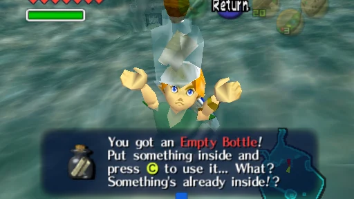 Child Link floating underwater in Lake Hylia in Ocarina of Time, holding a bottle overhead, with the on-screen message reading "You got an Empty Bottle! Put something inside and press C to use it... What? Something's already inside!?"
