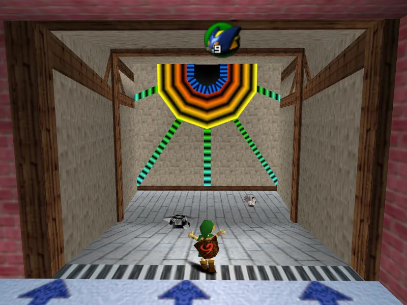 Young Link at the start of the Bombchu Bowling lane in the N64 Ocarina of Time, facing a walled lane with a Cucco and a small dark obstacle on the floor and a large orange-and-yellow target ringed by green spokes at the far end, with the Bombchu count reading 9 at the top of the screen.