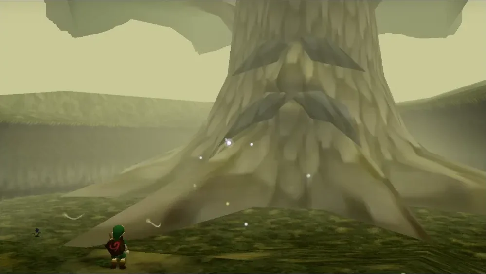 Child Link standing in front of the Great Deku Tree in Kokiri Forest, the entrance to the first dungeon in Ocarina of Time on N64.