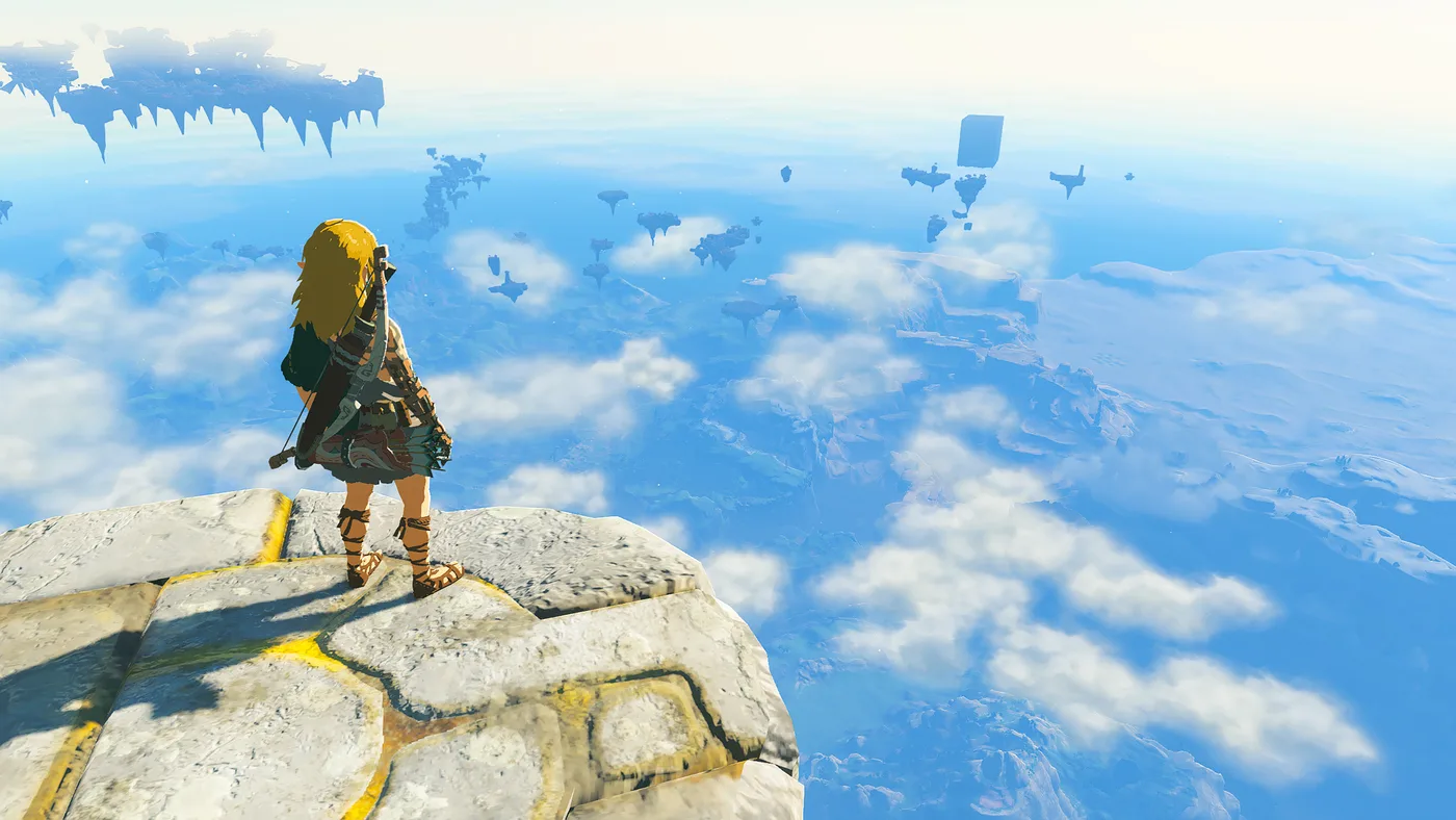 A sky island suspended above the clouds over Hyrule in the Nintendo Switch 2 Edition of Tears of the Kingdom, with more floating landmasses visible in the distance under a warm sky.